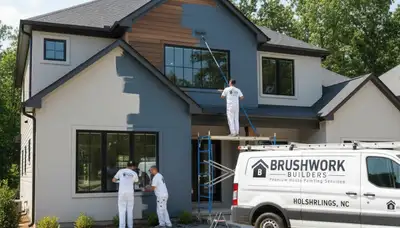 Professional house painters working on residential exterior in Durham, NC