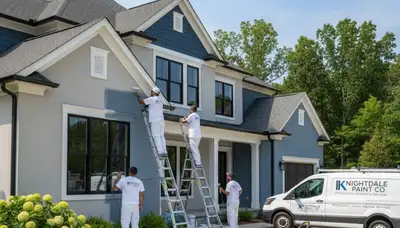 Professional house painters working on residential exterior in Durham, NC